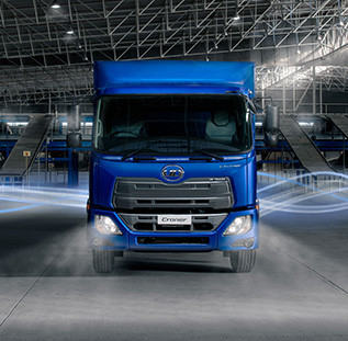 Blue delivery truck in a modern warehouse with blue motion lines.