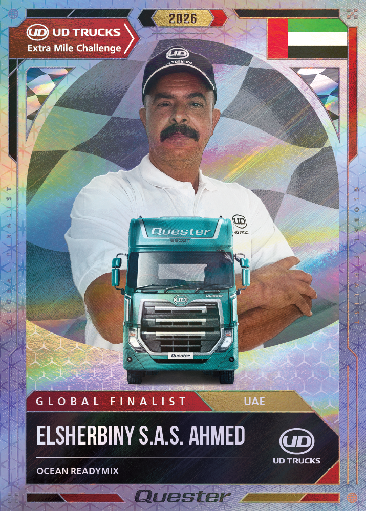 Man with mustache in UD Trucks uniform, UAE flag, green truck graphic in front.