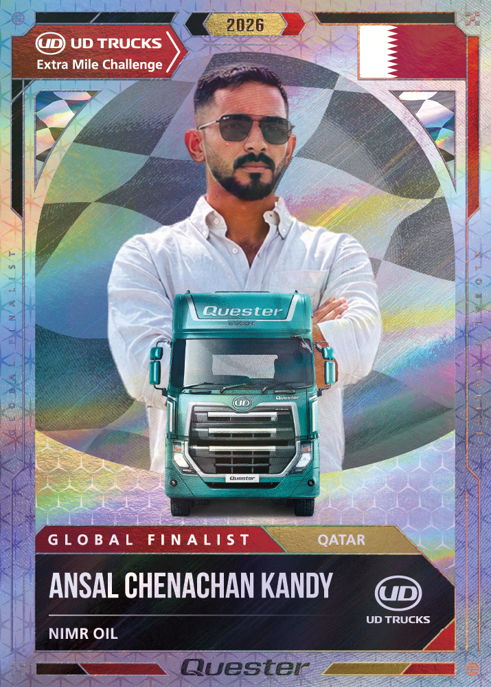 Man in sunglasses stands confidently behind a green UD Quester truck with colorful background.