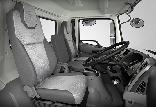 Gray truck cabin interior with two seats and a black dashboard.